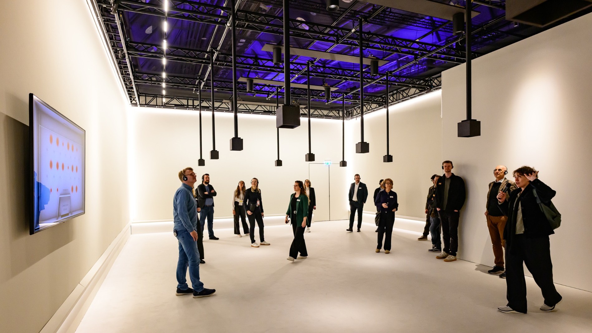 Trade fair visitors in a room at The Living Light