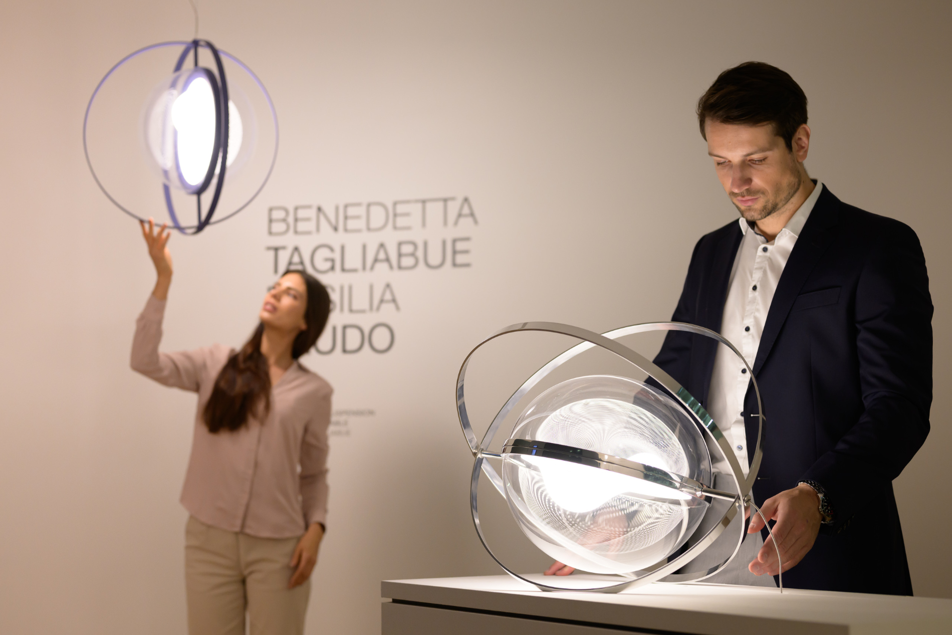 A woman and a man look at lights