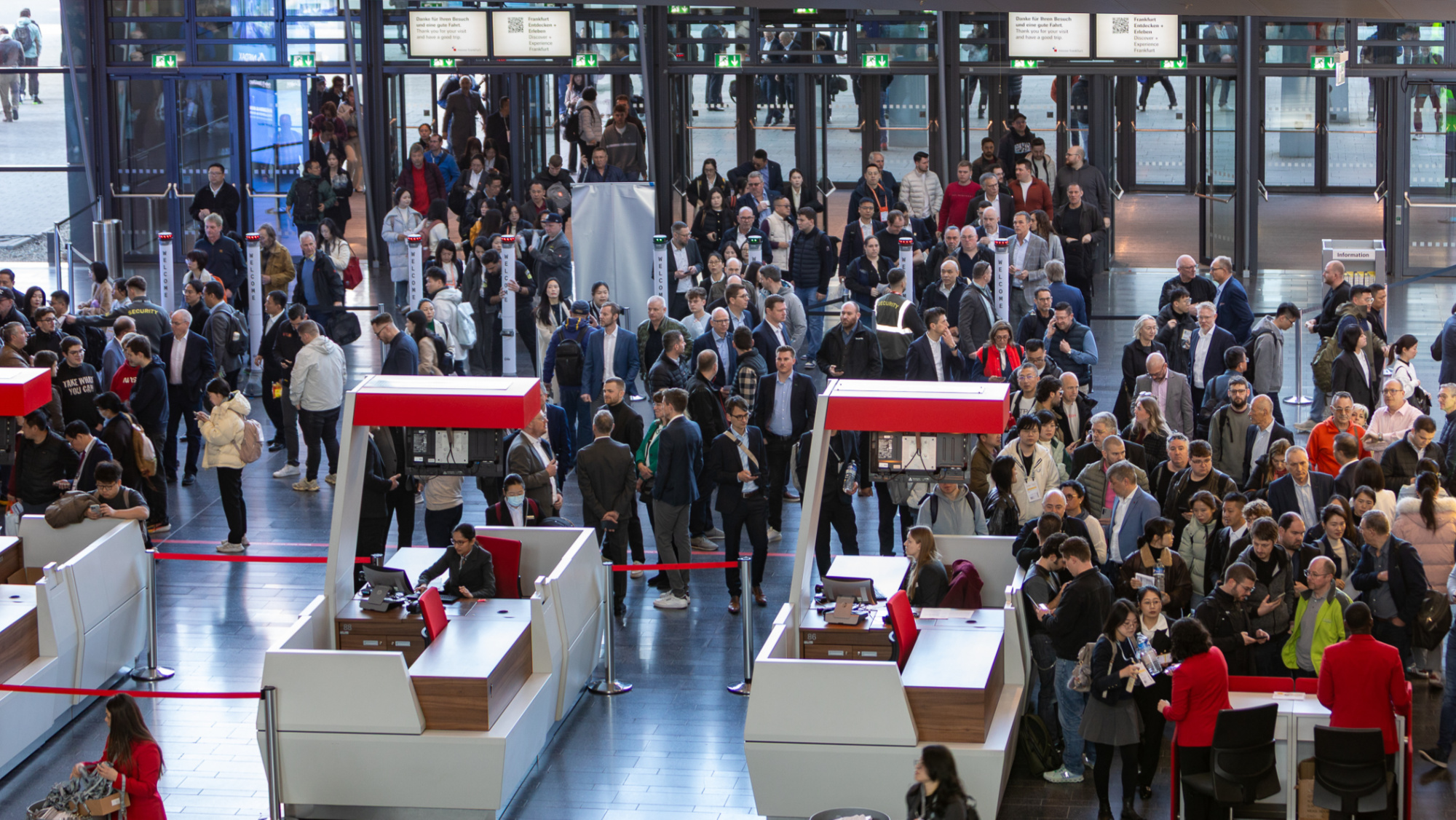 A crowd outside the entrance to an exhibition hall